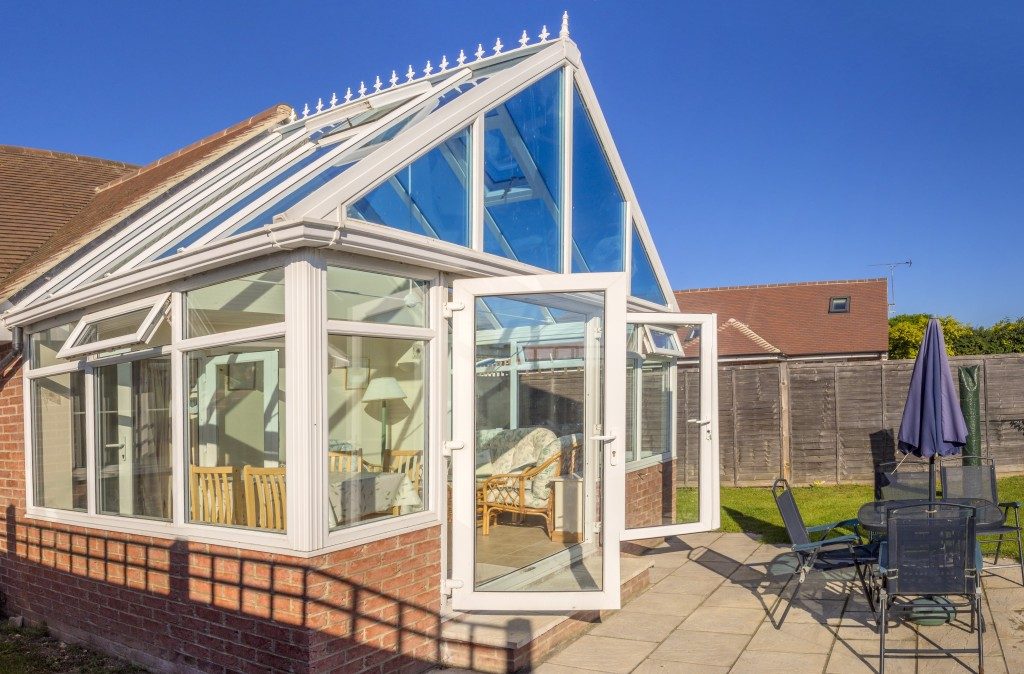 conservatory tables chairs plants room in house next to garden