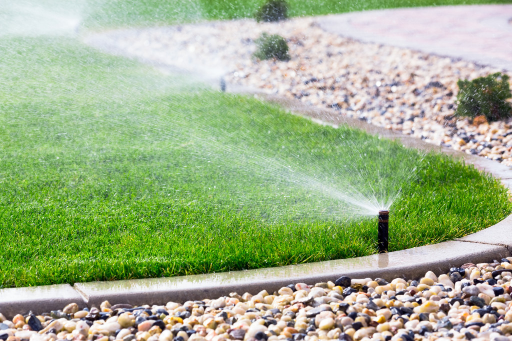 A backyard with sprinklers