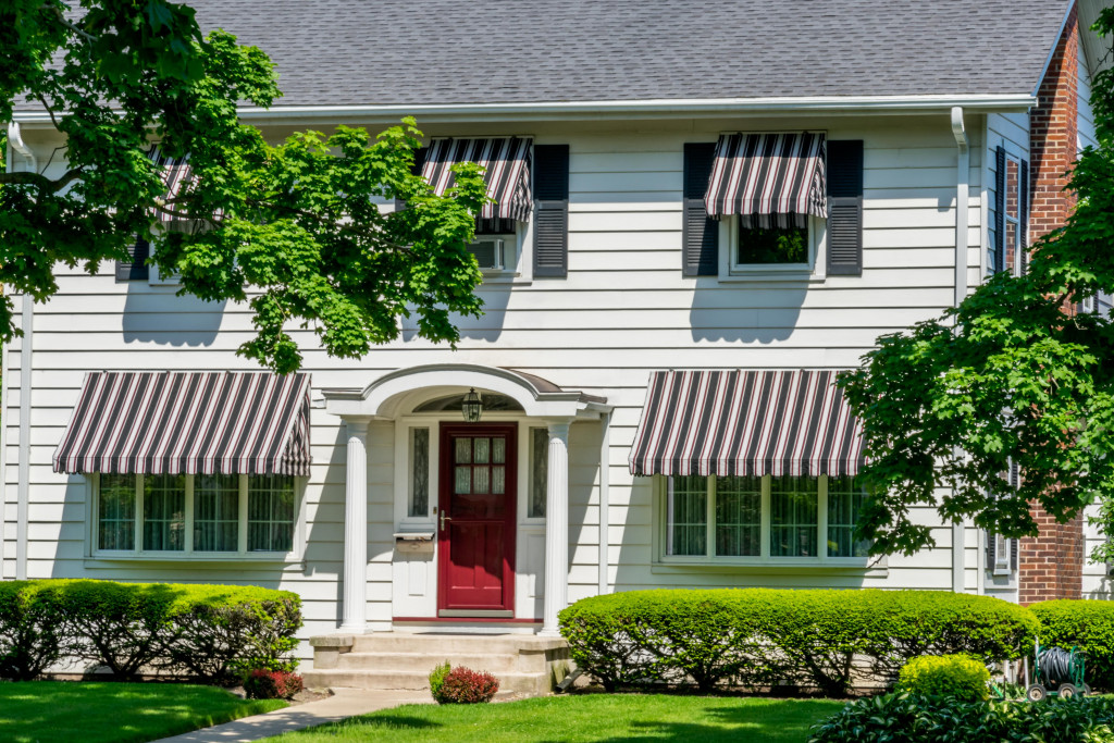 house with curb appeal due to fresh sidings and landscaping