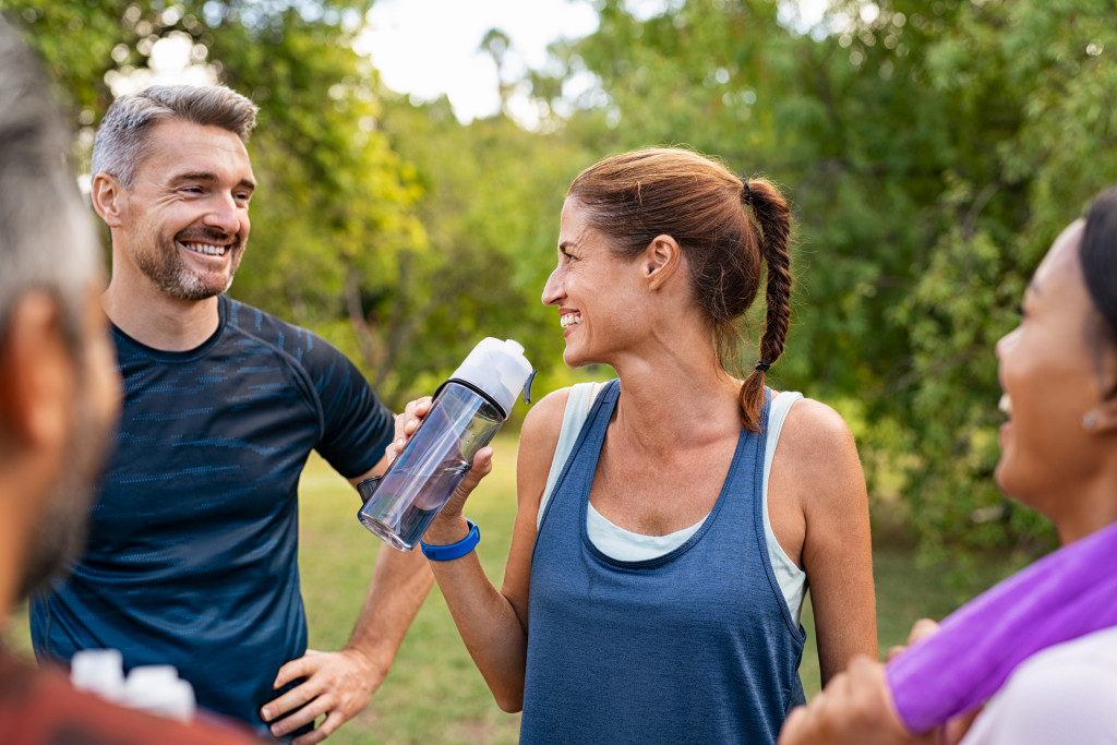 active people talking after a workout outdoors