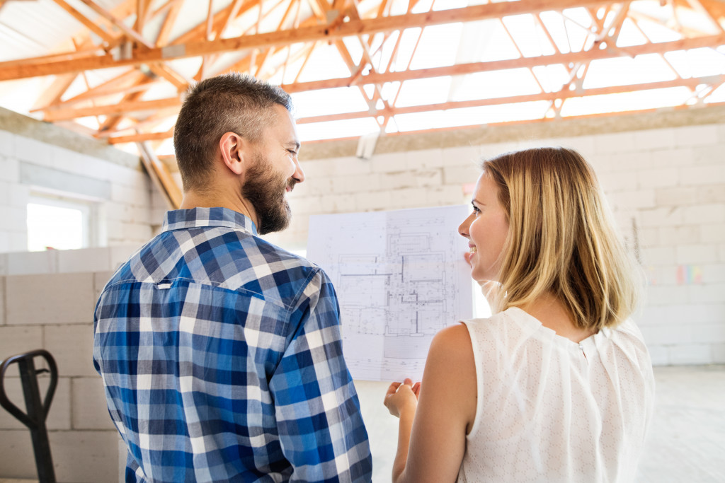 couple checking their home under construction