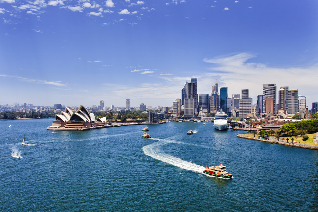 an overview of the city of Sydney in australia with boats all around